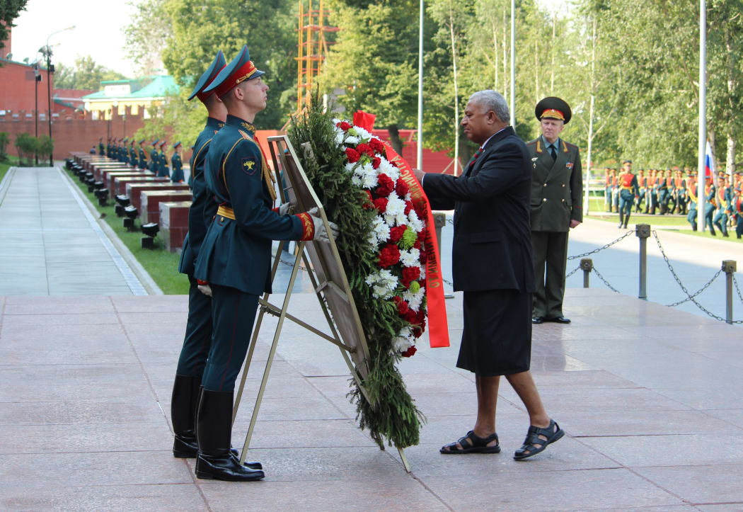 Fiji's Prime Minister Frank Bainimarama pays respects at the Tomb of the Unknown Soldier in Moscow during his visit to Russia in 2013.