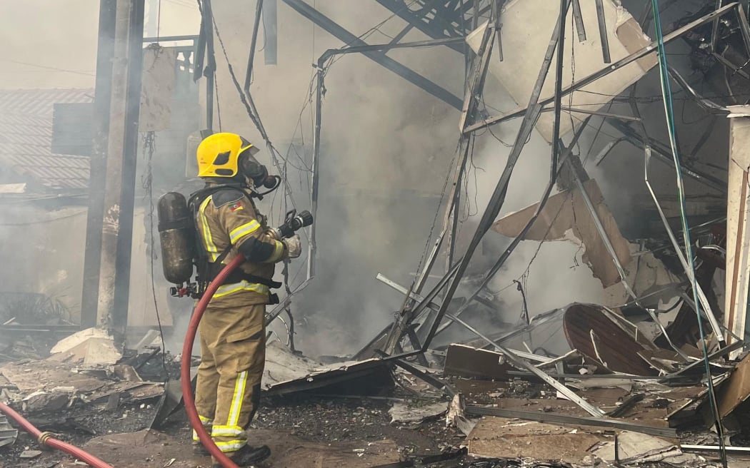 Handout picture released by Rio Grande do Sul Fire Department showing firefighters working on the site of a plane crash in Gramado, Rio Grande do Sul, Brazil on 22 December, 2024.