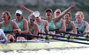 Oxford University celebrate their victory in the annual boat race against Cambridge on the Thames.