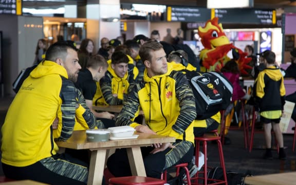 Wellington Phoenix players say goodbye to fans at Wellington airport.