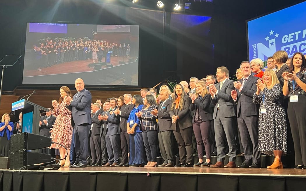 National's 2023 election campaign candidates stand on stage at the party's national conference in Wellington.