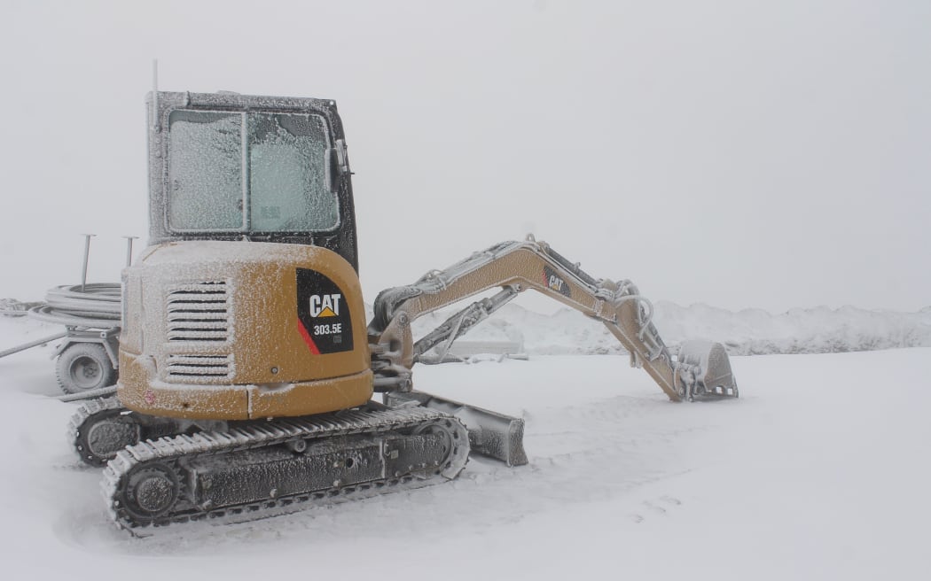Snow covered a digger at Cardrona skifield yesterday.