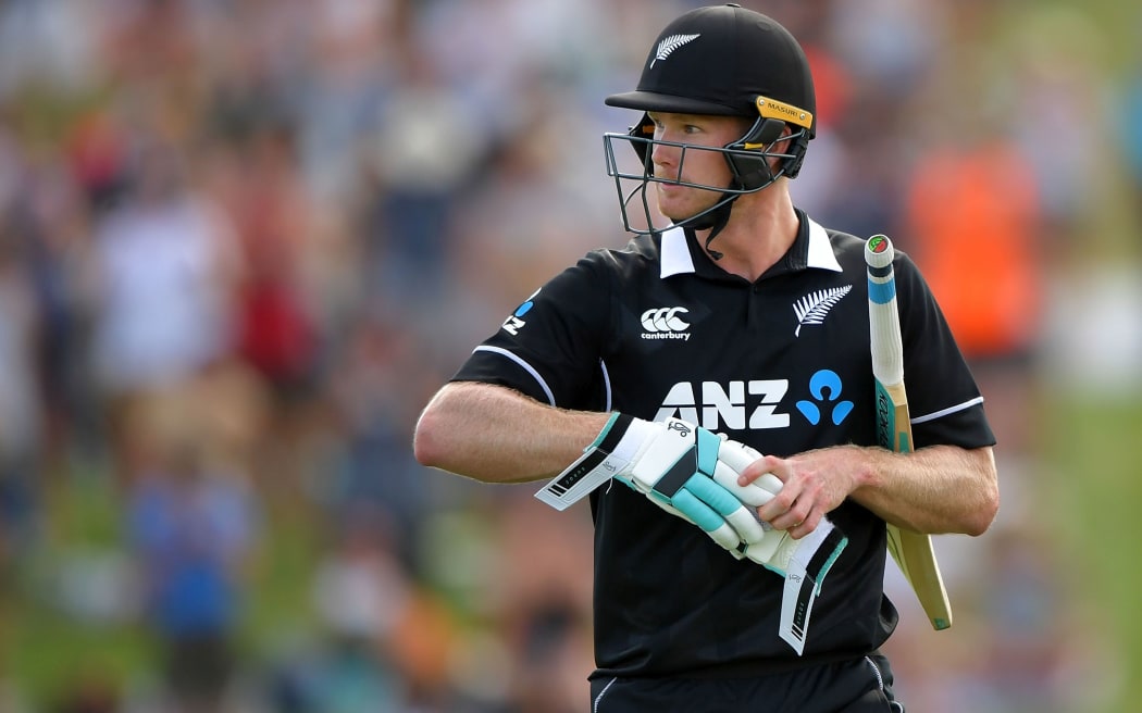 Blackcaps' James Neesham walks from the field at the end of the Backcaps innings.