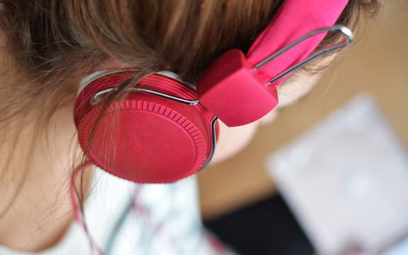 Woman with headphones.