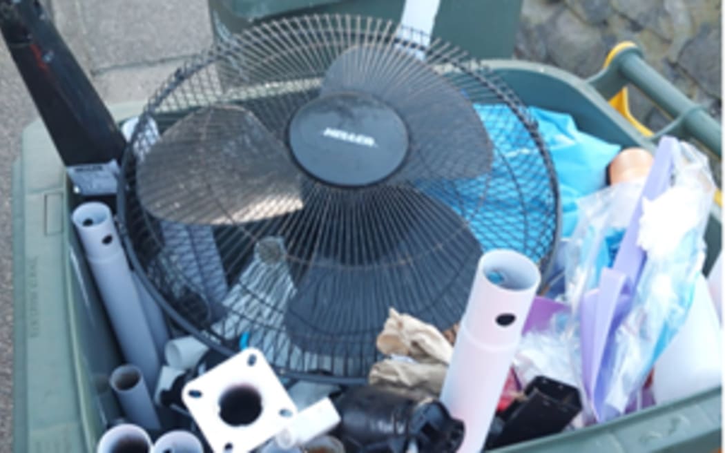 A yellow-top recycling bin filled with items that are not accepted at the Tauranga Material Recovery Facility where the bins’ contents are taken. Photos supplied