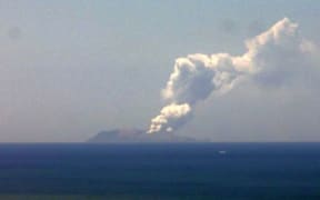 The ash cloud rising from White Island today.