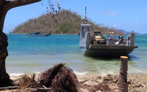 The New Zealand Defence Force brings relief equipment and aid supplies ashore at Lomaloma.