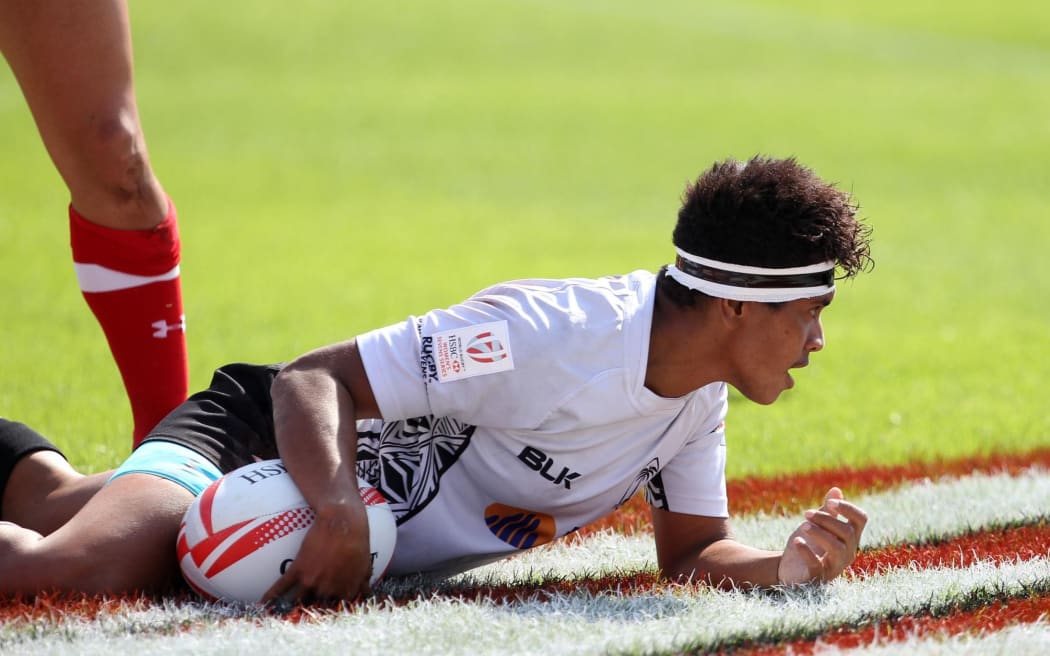 The Fiji women's team score against Canada on their way to an unbeaten start on day one of the Dubai Sevens.