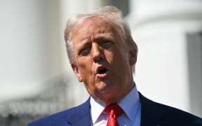 US President Donald Trump speaks during a photo opportunity with autoracing champions on the South Portico of the White House on April 9, 2025, in Washington, DC. (Photo by SAUL LOEB / AFP)