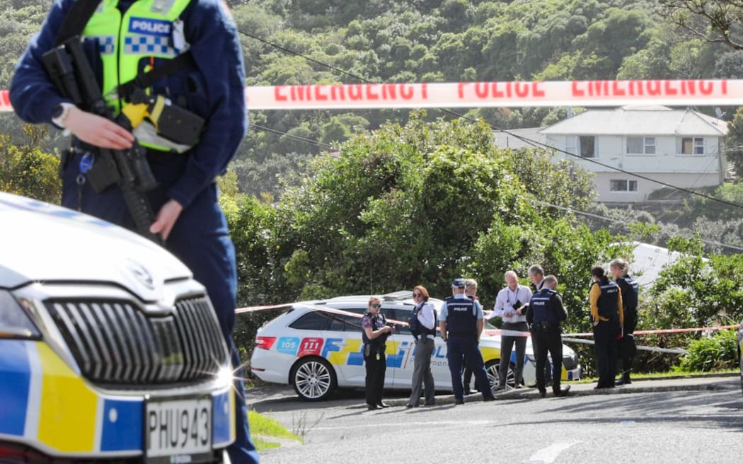 Armed police are seen at the top of Totara Road in Miramar, Wellington, after a person was found dead at a residential property on 16 October, 2023.