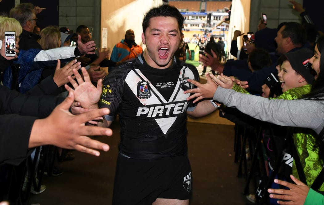 Brandon Smith celebrates with Kiwis fans after the team's win over Australia at Mt Smart Stadium.