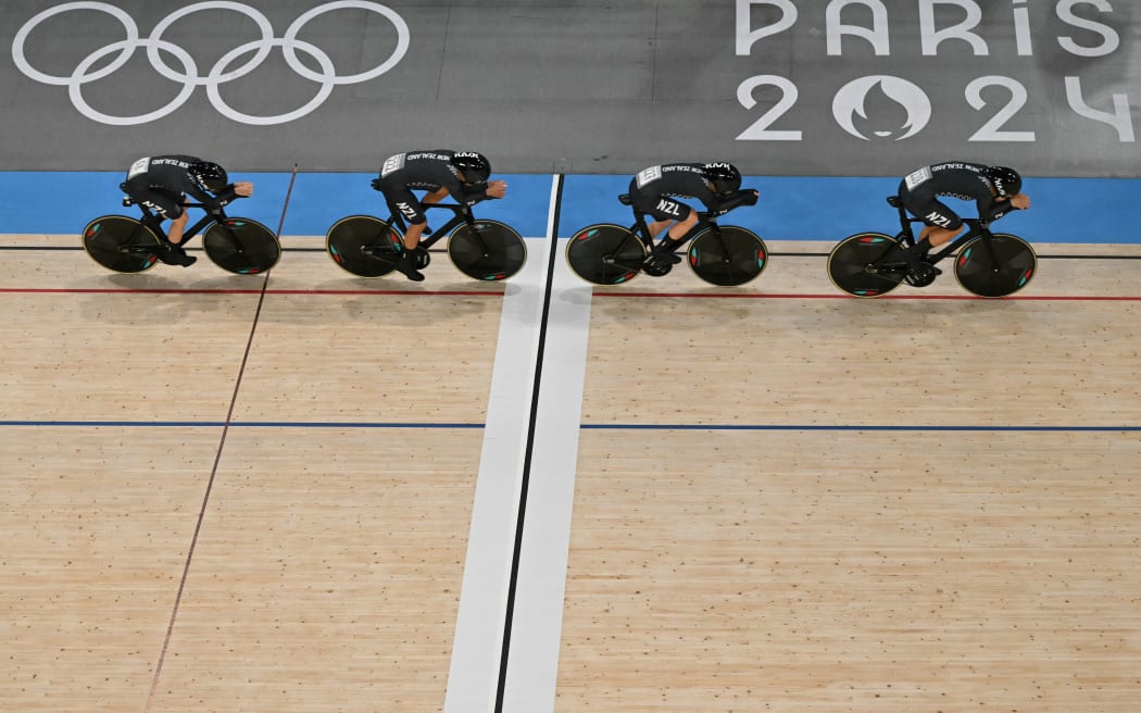 An overview shows New Zealand's Ally Wollaston, New Zealand's Bryony Botha, New Zealand's Emily Shearman and New Zealand's Nicole Shields competing in a women's track cycling team pursuit qualifying round of the Paris 2024 Olympic Games at the Saint-Quentin-en-Yvelines National Velodrome in Montigny-le-Bretonneux, south-west of Paris, on August 6, 2024. (Photo by Sebastien BOZON / AFP)