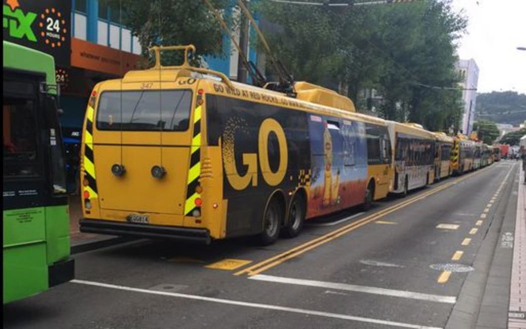 Buses backed up along Manners Street due to large truck blocking the road.
