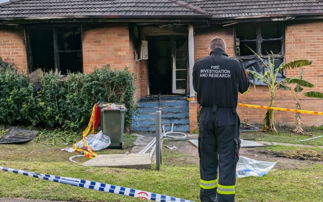A man is in custody after three young children died in a house fire in Sydney overnight.
