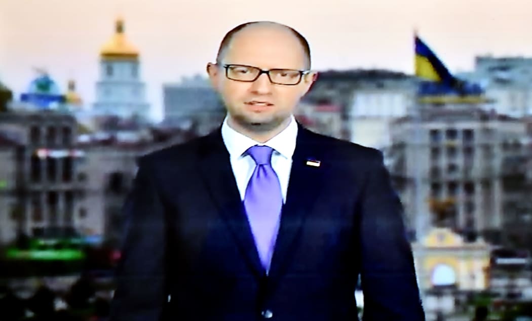 Ukrainian Prime Minister Arseniy Yatsenyuk delivers a statement to the Ukrainian people on television.