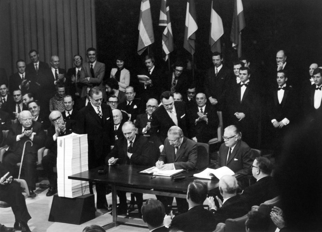 England Prime Minister Edward Heath (C) signs the UK accession Treaty to the European Economic Community in Brussels on January 22, 1972.