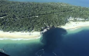 A sinkhole swallowed vehicles at a campsite near Queensland's Rainbow Beach.

AAP / Higgins Storm Chasing