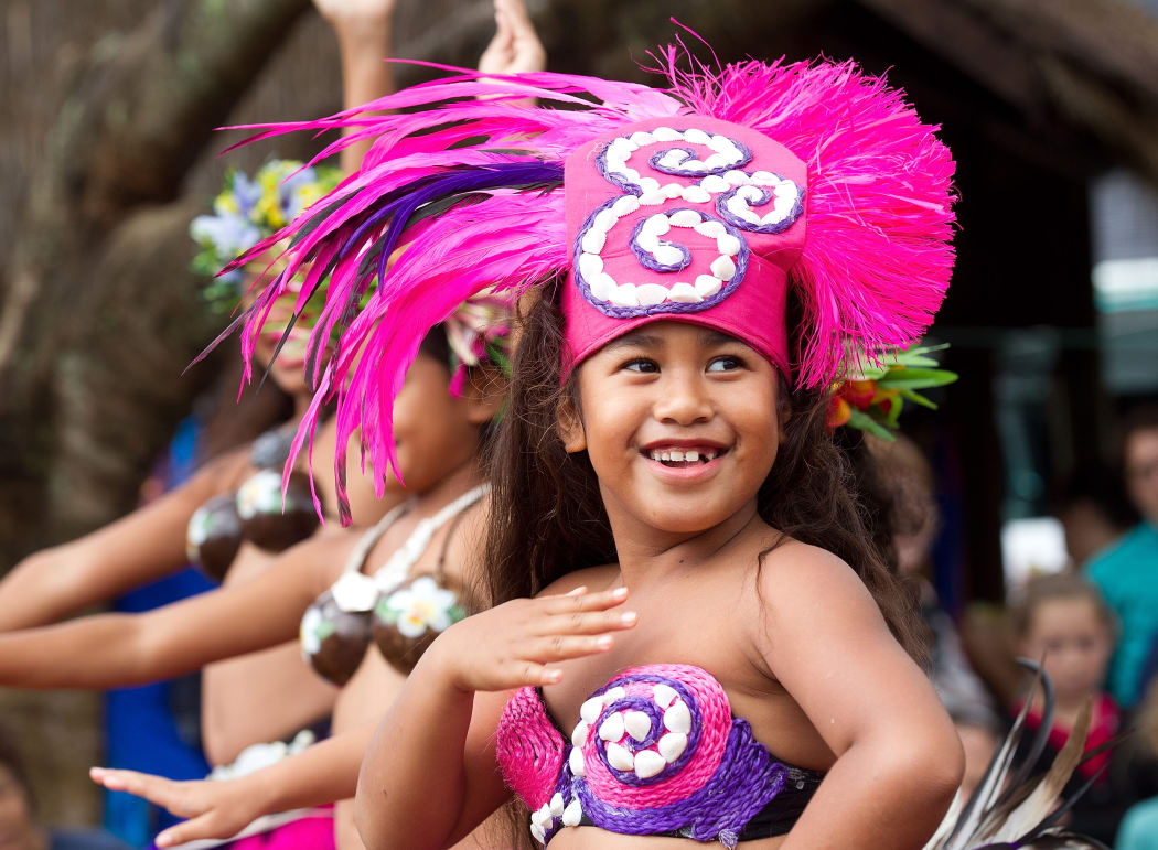 Children perform traditional dances during a visit by US Secretary of State Hillary Clinton at the Avarua markets in Rarotonga, Cook Islands on September 1, 2012.