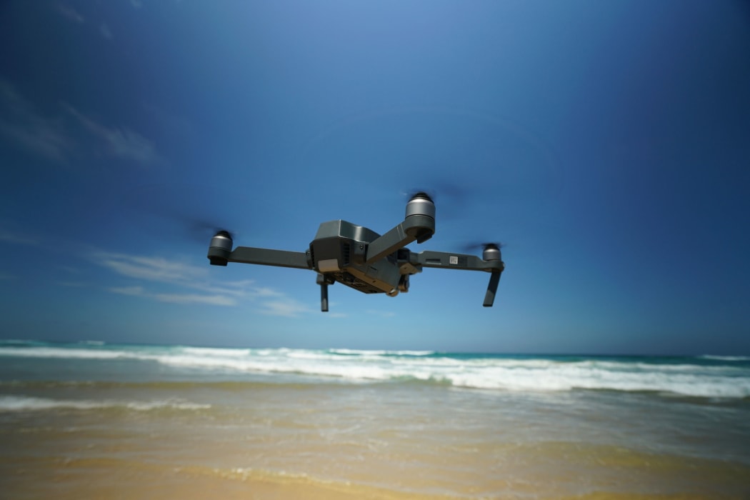 Drone flying over the ocean