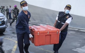 JAKARTA, INDONESIA - JANUARY 12: The National Transportation Safety Committee carry the Flight Data Recorder (blackbox) of Sriwijaya aircraft SJ 182 that crashed on January 12, 2021 in Jakarta, Indonesia.
