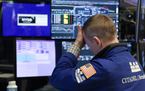 A trader works on the floor of the New York Stock Exchange in New York City, on April 7, 2025. Wall Street stocks opened sharply lower Monday, joining a global selloff on worries that a trade war induced by US President Donald Trump's tariffs will spark a global economic slowdown. (Photo by TIMOTHY A. CLARY / AFP)
