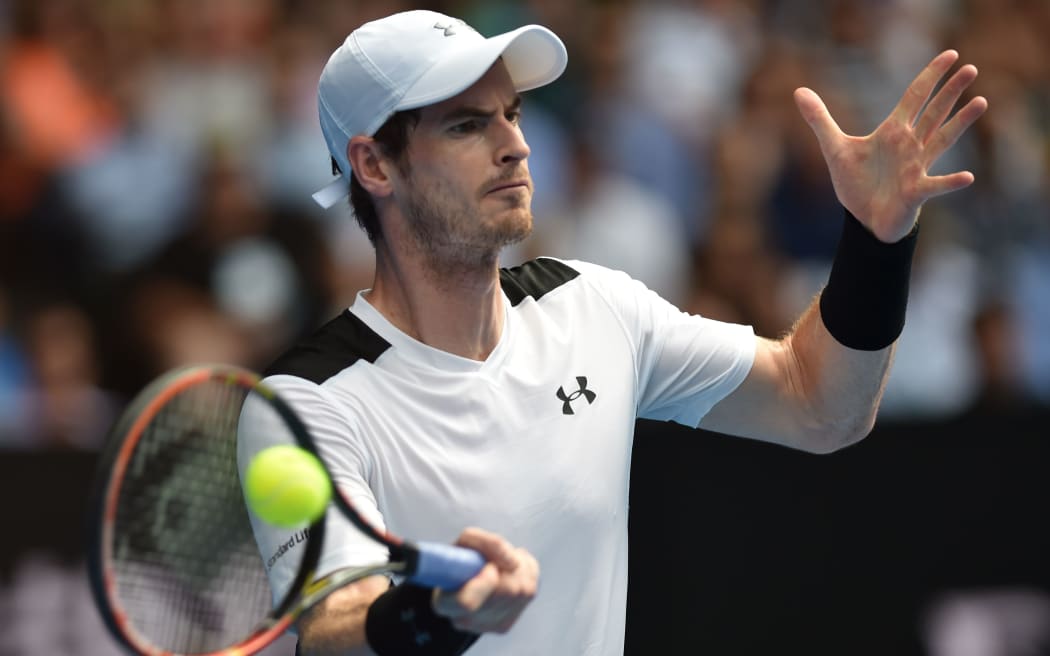 Andy Murray returns against David Ferrer at the 2015 Australian Open in Melbourne, January 27, 2016. AFP PHOTO / SAEED KHAN