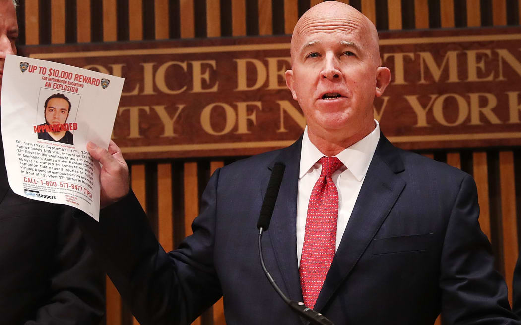 NYC police commissioner James O'Neill holds up a picture of Ahmad Khan Rahami, the man believed to be responsible for the explosion in Manhattan.