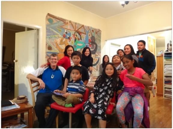 John with his wife Judy McFall-McCaffery with her sister Jackie (rear) and the couples children (rear) and grandchildren (front).