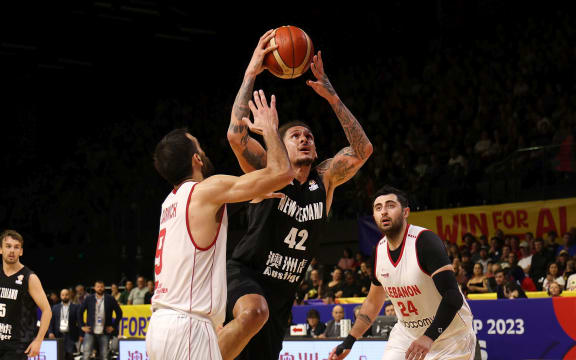 Tall Blacks Isaac Fotu in action against Lebanon, 2023.