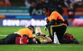 Hurricanes centre Wes Goosen gets medical attention after a tackle from Chiefs second five Johnny Fa'auli on 13 July, 2018.