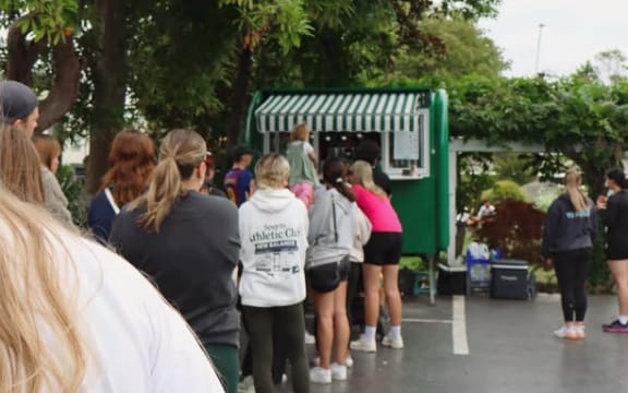 A line of thirsty patrons snake from @Gigi's matcha van in The Vale, Christchurch.