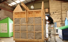 Paora Smallman works on the tiny house protoype