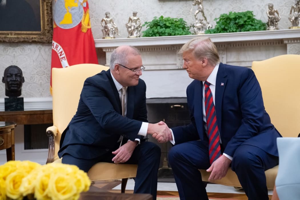Scott Morrison and Donald Trump shake hands in the Oval Office during Morrison's official visit to White House last month.