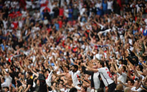 England supporters celebrate their win in the UEFA EURO 2020 round of 16 football match between England and Germany at Wembley Stadium in London on June 29, 2021.
