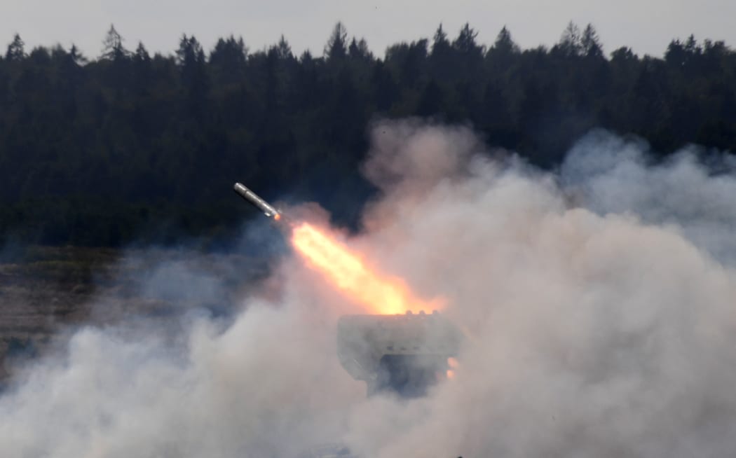 The TOS-1 Solntsepyok (Blazing Sun) multiple thermobaric rocket launcher shoots during a demonstration of its running and firing capabilities at the ARMY 2020 International Military and Technical Forum at the Patriot Park, in Alabino, Moscow region, Russia.
