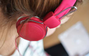 Woman with headphones.