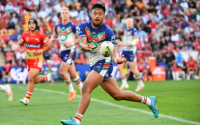 Adam Pompey of the Warriors makes a run during the NRL Round 27 match between the Redcliffe Dolphins and the New Zealand Warriors.