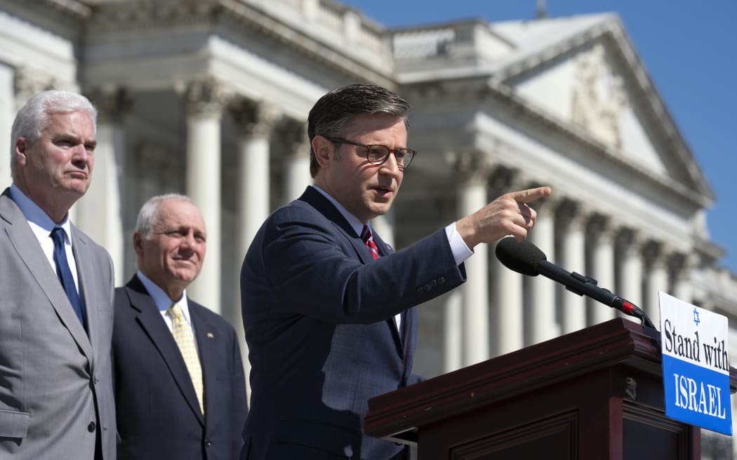 Speaker of the House Mike Johnson, joined from left by Majority Whip Tom Emmer, and House Majority Leader Steve Scalise, speaks to reporters at the Capitol in Washington on Thursday, 16 May, 2024, about President Joe Biden pausing a shipment of bombs to Israel.