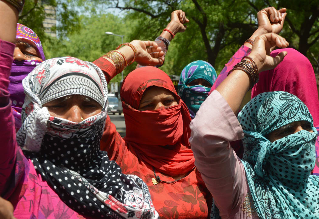 Demonstrating villagers protest in New Delhi against the gang-rape of a lower caste Dalit in nearby Haryana state.
