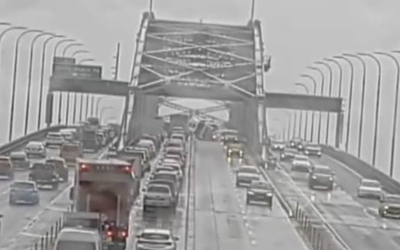 The truck rolled on its side, blocking two lanes.