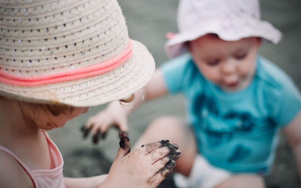 Two young children playing