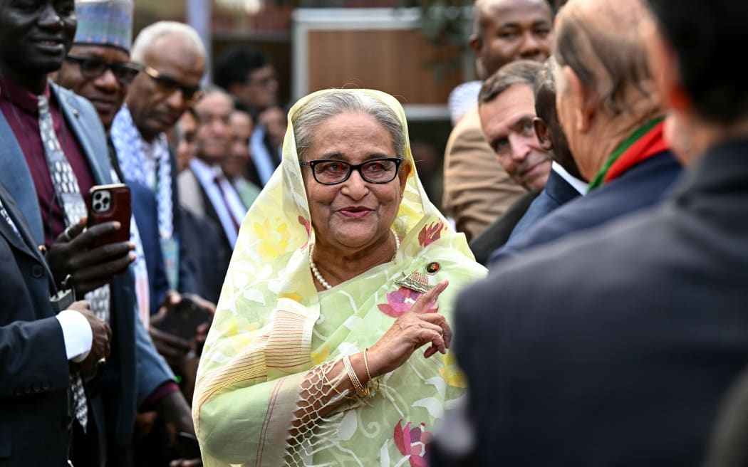 (FILES) Bangladesh's Prime Minister Sheikh Hasina accepts greetings from the assembled media and election observers during a press conference, a day after she won the 12th parliamentary elections, in Dhaka on January 8, 2024.