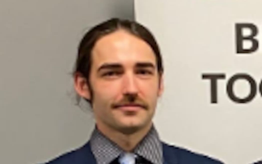 Mason Helm pictured in 2023 winning a Waikato University Law Students' Association paper.