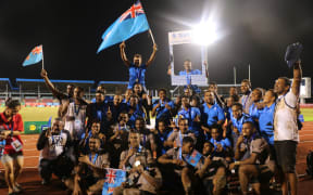 Fiji league teams celebrating their gold medals.