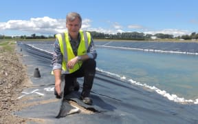 Carterton District Council chief executive Geoff Hamilton with some of the lining damage.