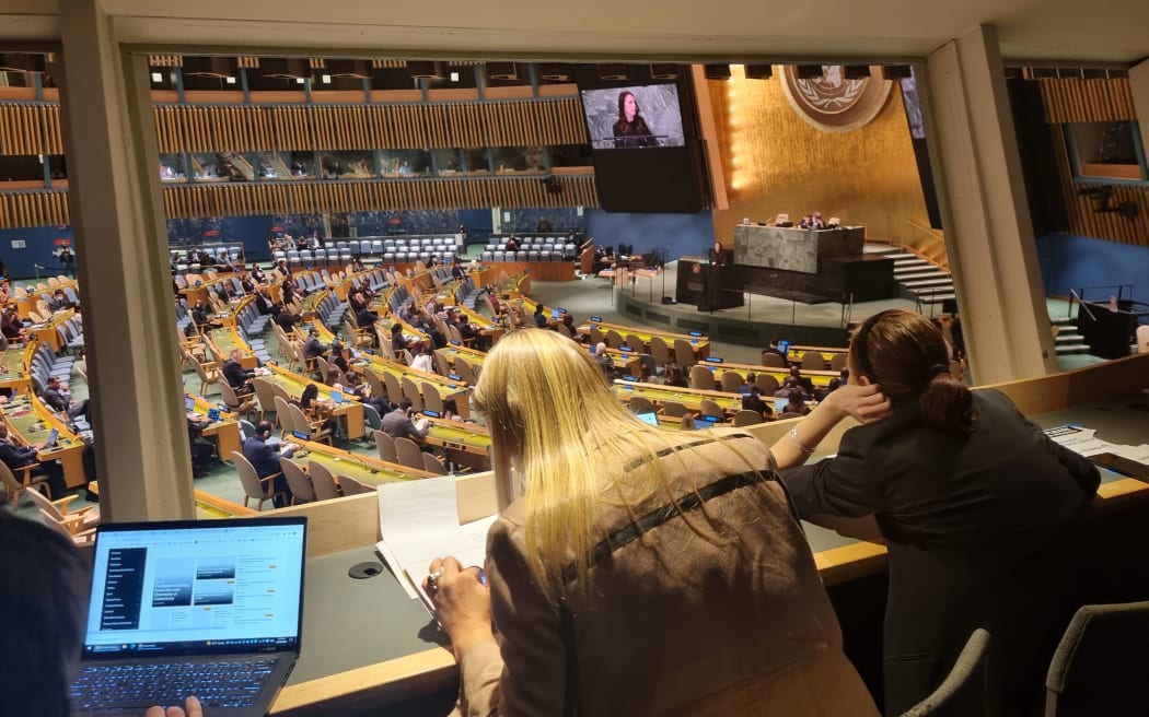 Journalists file while watching Prime Minister Jacinda Ardern speak at the United Nations.