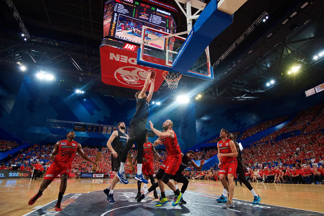 Thomas Abercrombie of the New Zealand Breakers drives for a dunk.