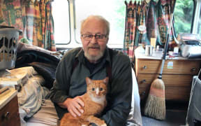 After a rough few years, Southland retiree John - and his cat Puss - now lives in a caravan, which was a gift from friends who were worried about him living in a tent.