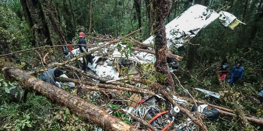 The crash site of a Swiss-made Pilatus aircraft at Menuk mountain in Oksibil.