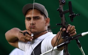 Tonga's Arne Hans Jensen shoots an arrow during the Olympic archery competition in Rio.